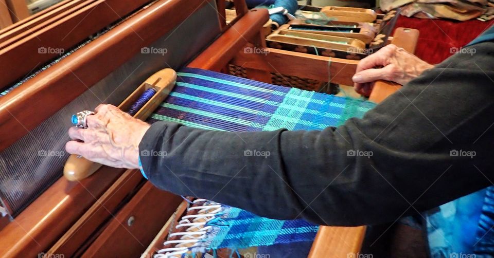 Old woman at a loom