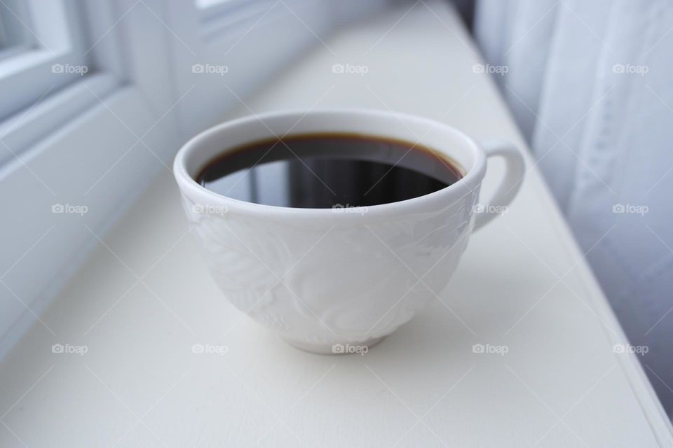 Black coffee in a white cup 