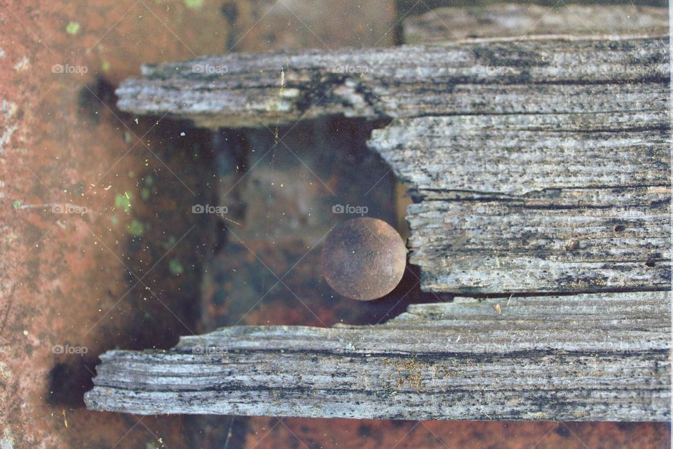 Rusty iron and rotting, weathered wood