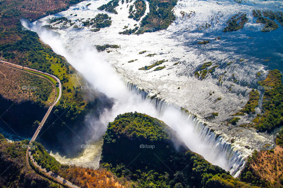 I was amazed at the bigness of this natural waterfall, one of the seven wonders of the world for a good reason. It stretches over 1.7km. Image of Vic falls in Africa