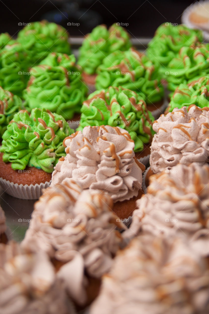 Cupcakes with brown and green cream