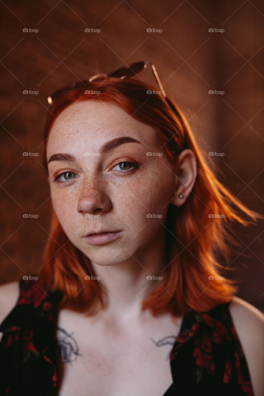 portrait photo of young woman with red hair