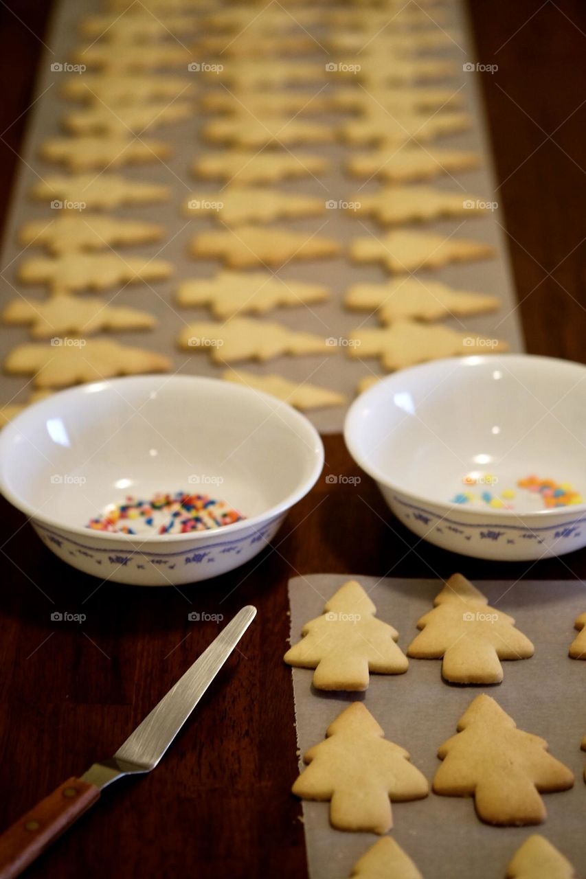 Making Christmas Cookies, holiday traditions, making sugar cookies, Christmas tree sugar cookies, assembling cookies for the holidays, family baking together