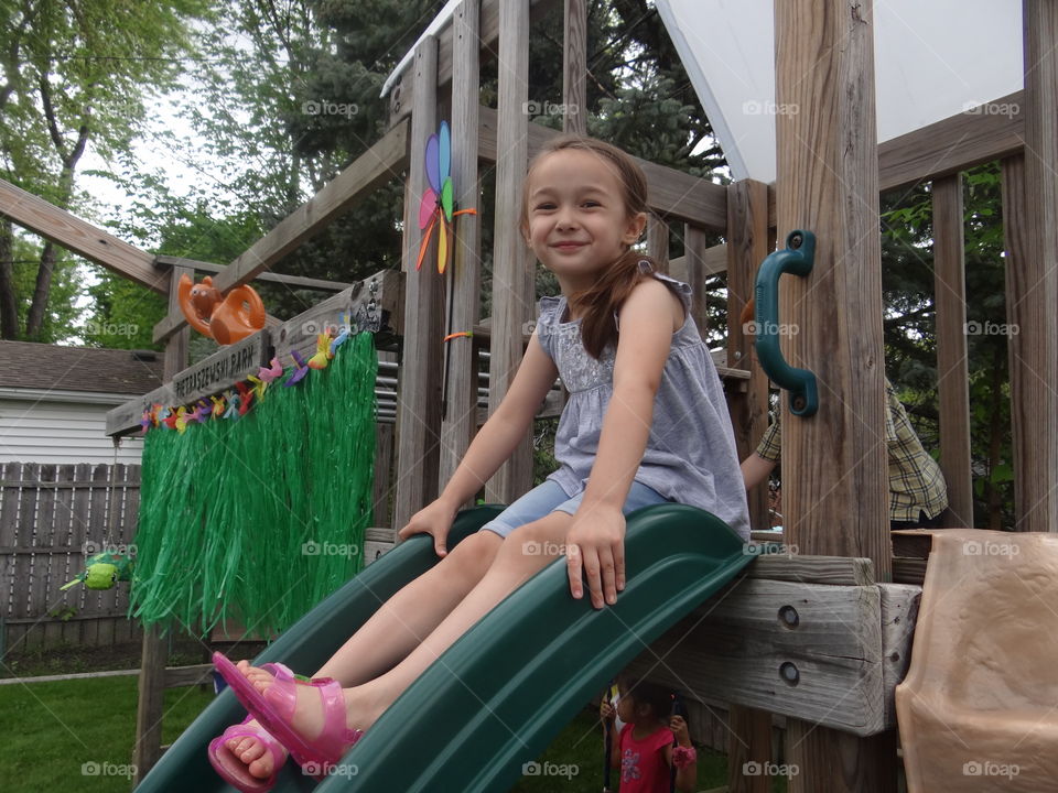 Wheeee!. My daughter,about to go down the slide