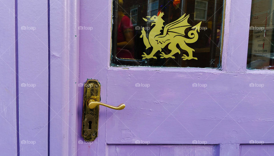 A purple door with Welsh Dragon