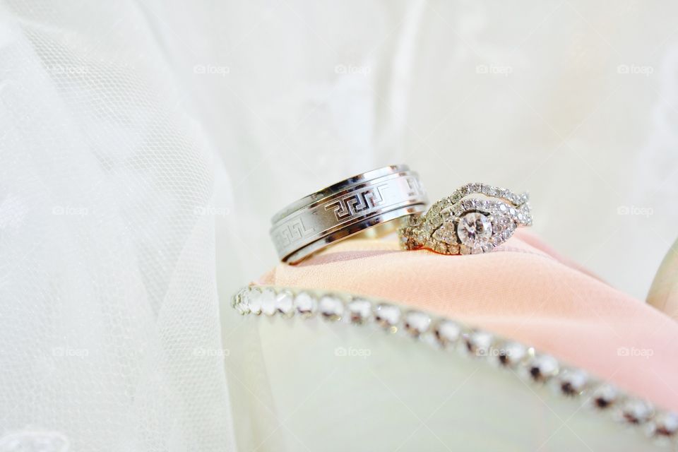 These are our gorgeous wedding rings on a shell ring holder 