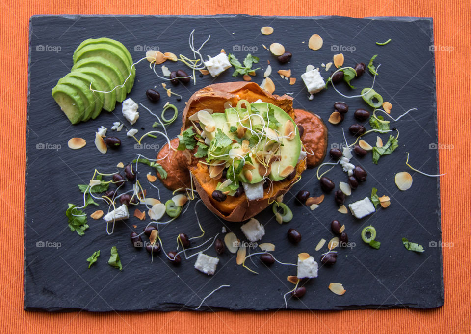 Stuffed baked sweet potato with avocado and black beans 