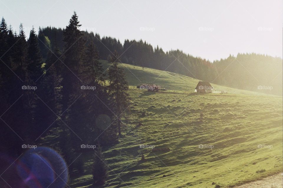 Countryside in the mountains at sunset time; taken with Olympus Om101 analog camera.