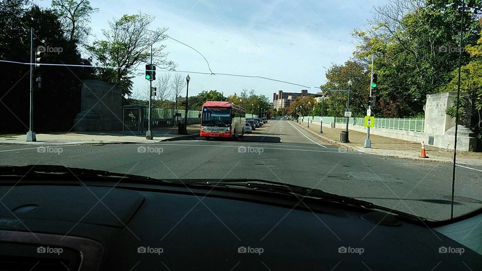Drivers view of street and bus