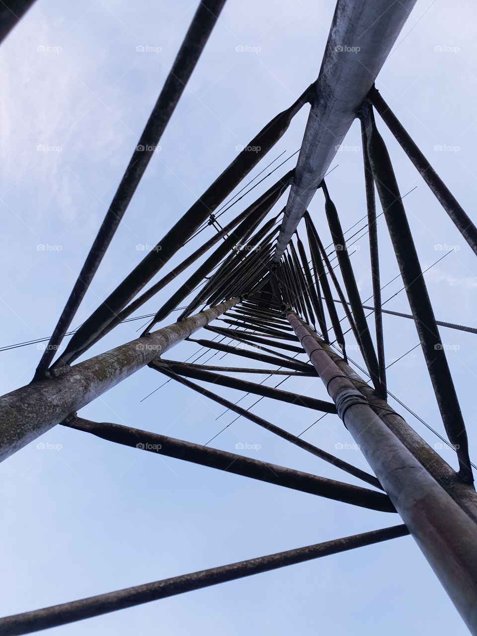 Transmission tower photographed from below.