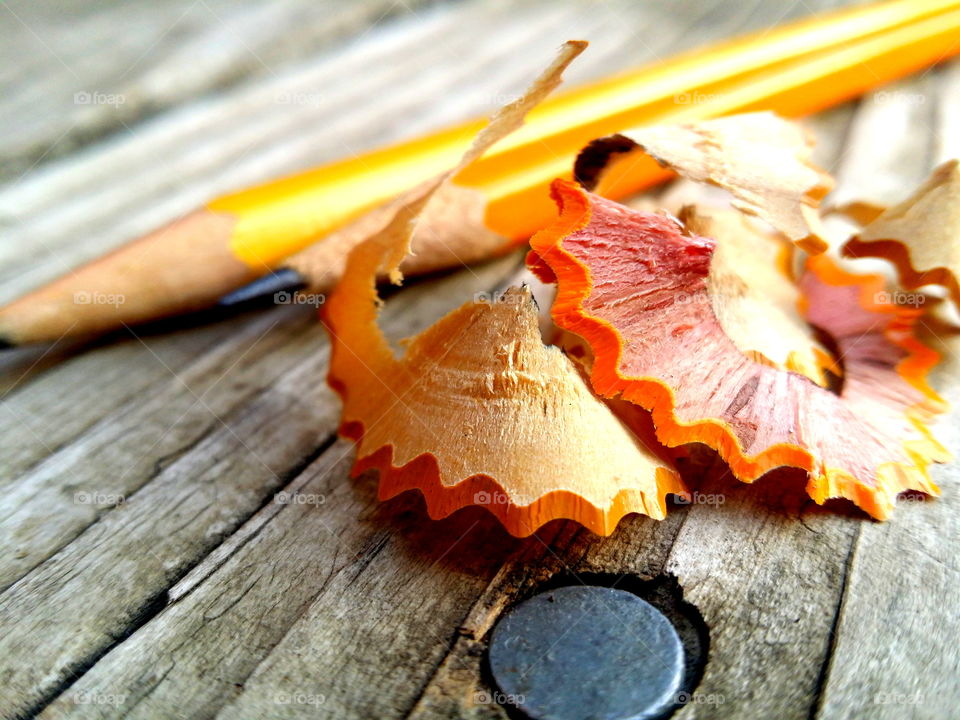 Pencils and shavings on table