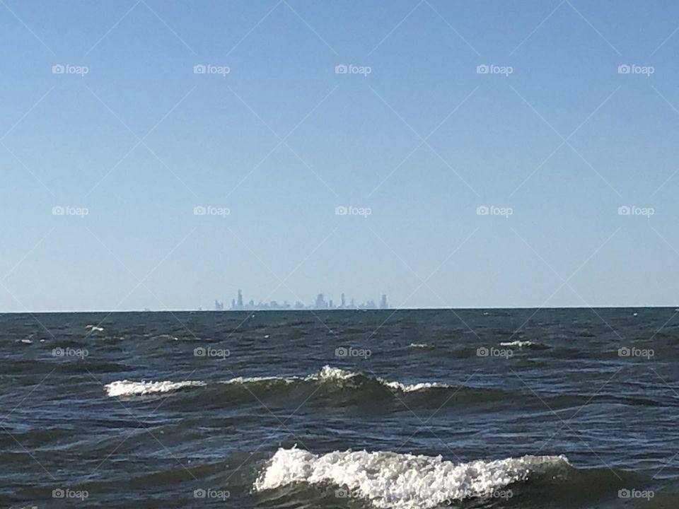 A windy day at the beach with amazing waves. 