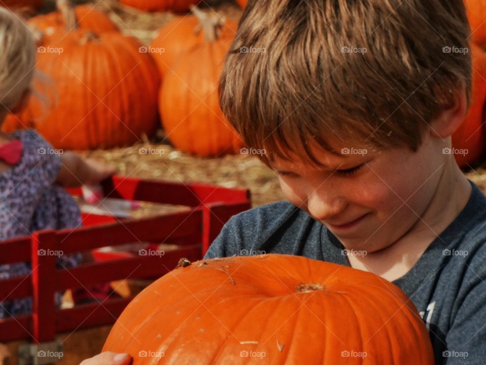 Happy Boy At The Pumpkin Patch
