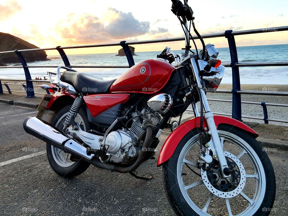 Red Motorbike Sea behind