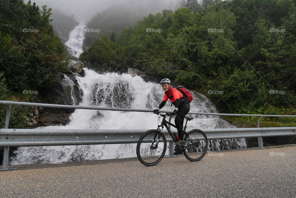 River behind Teenager on a Mountainbike 