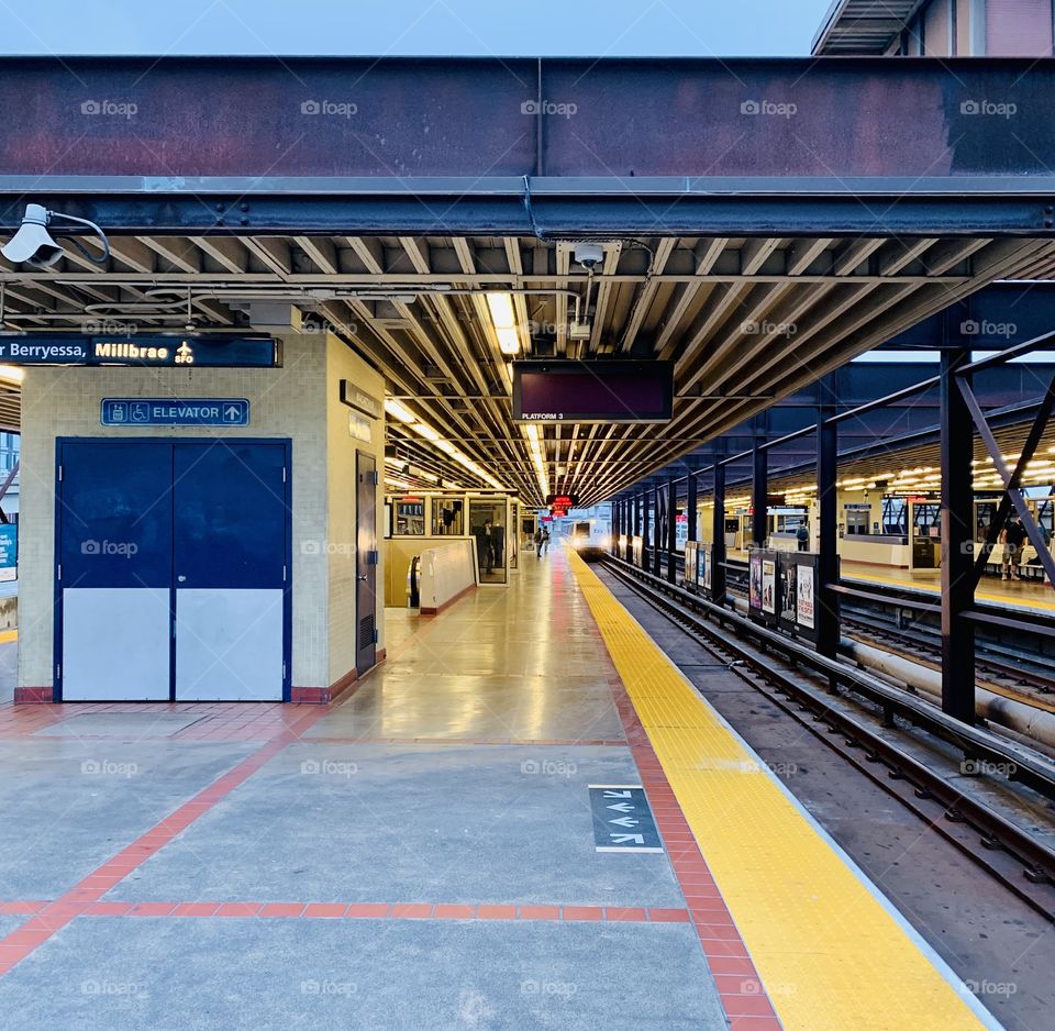The bart train pulling up to an empty station (during quarantine)