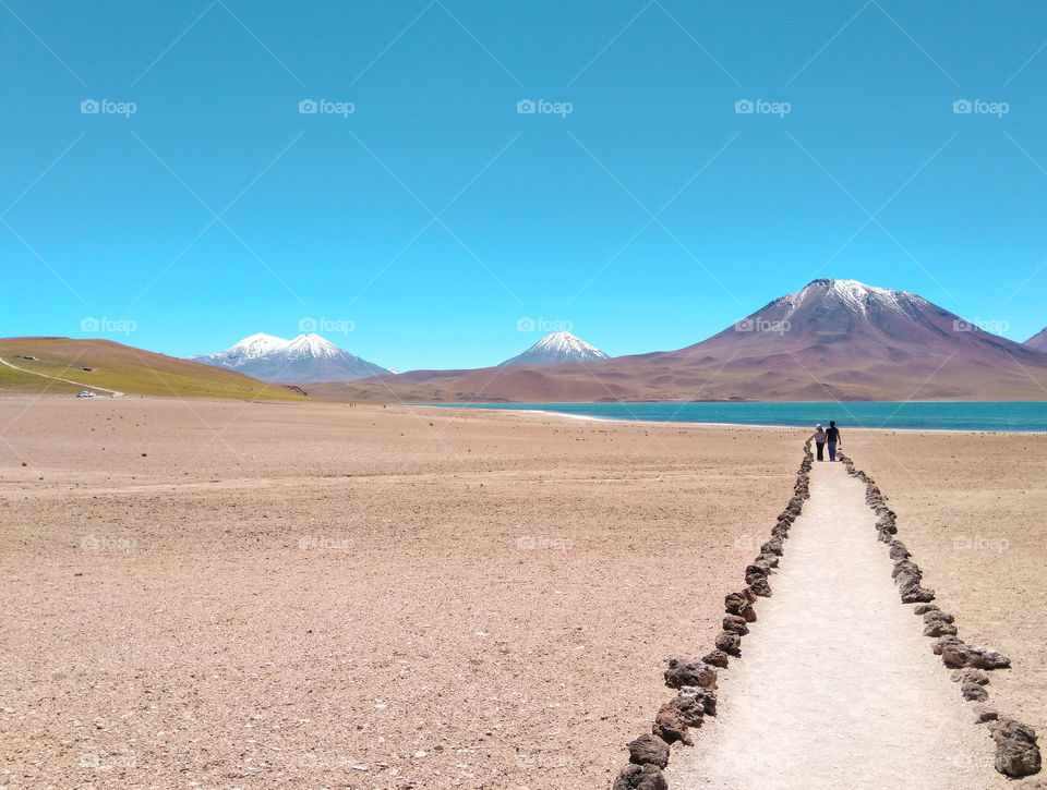 Couples walkng to the way of love, to the way of life. Landscape with a path in perspective