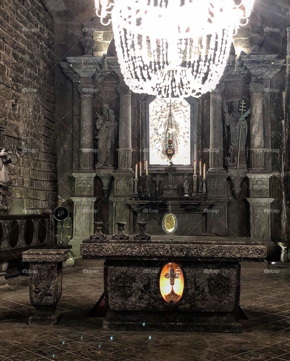 This is a altar in the Salt Mine in Wieliczka in krakow. It was deep underground you can see the big chandelier hanging from the ceiling. Must see tour