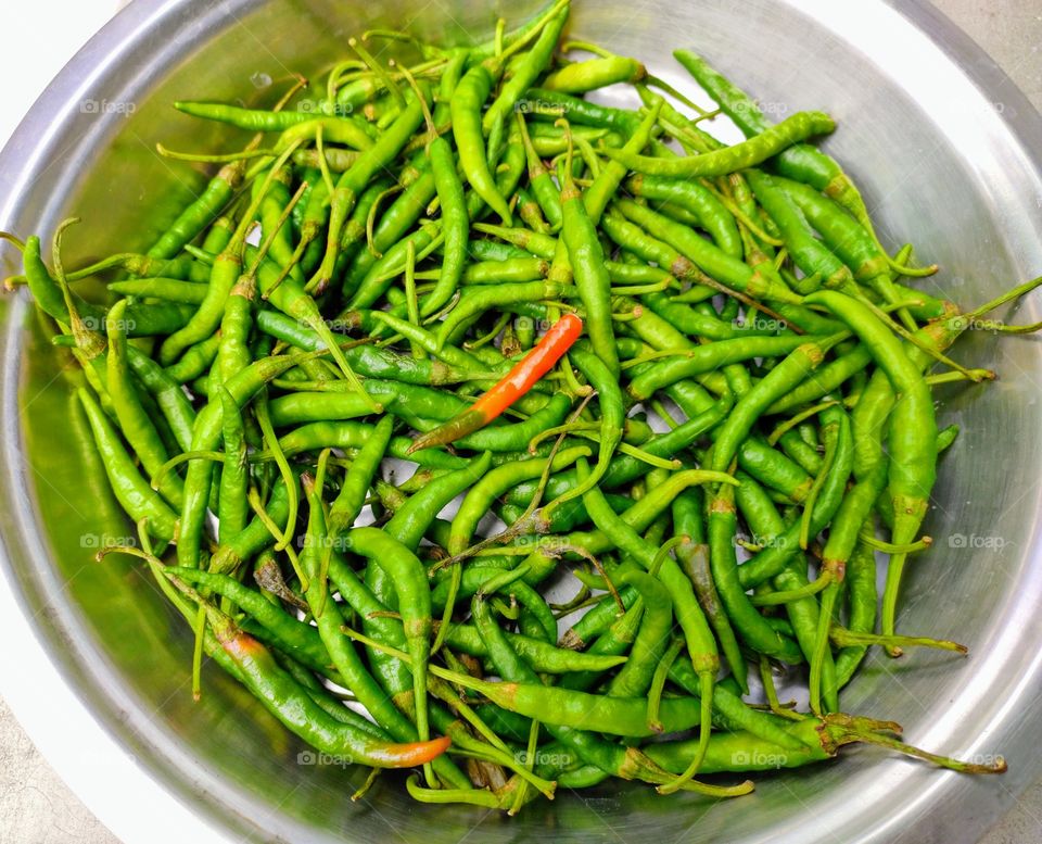 Green chilli on the dish