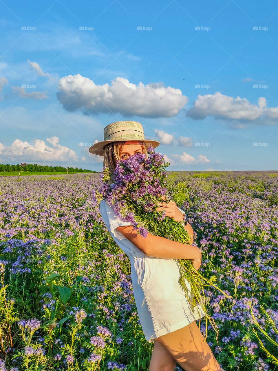 woman in field of violet flowers