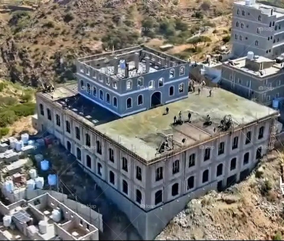 A stunning view of green mountains covered in fog in Yemen
