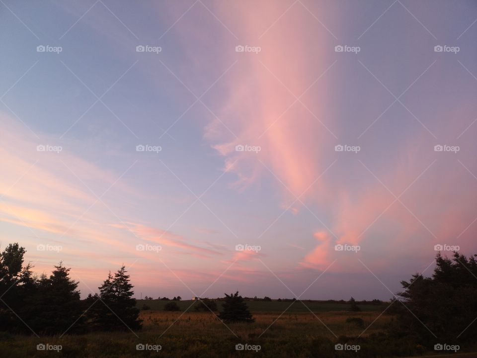 Patch of clouds pinked by the sunset, Prince-Edward Island, Canada