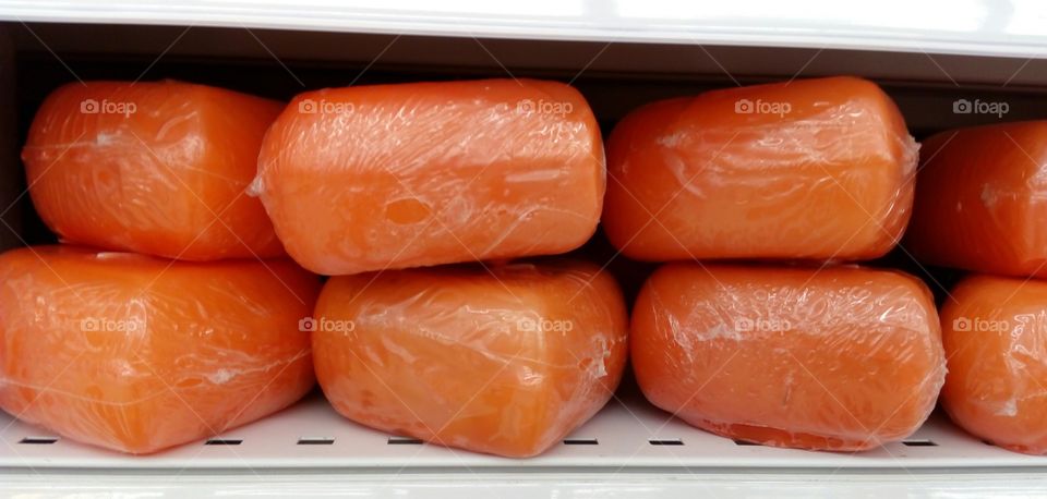 Candles placed on a shelf to be sold in the market