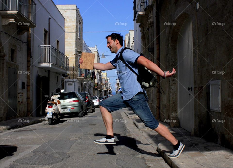 Funny walk . A funny walking moment of a man crossing street in Italy