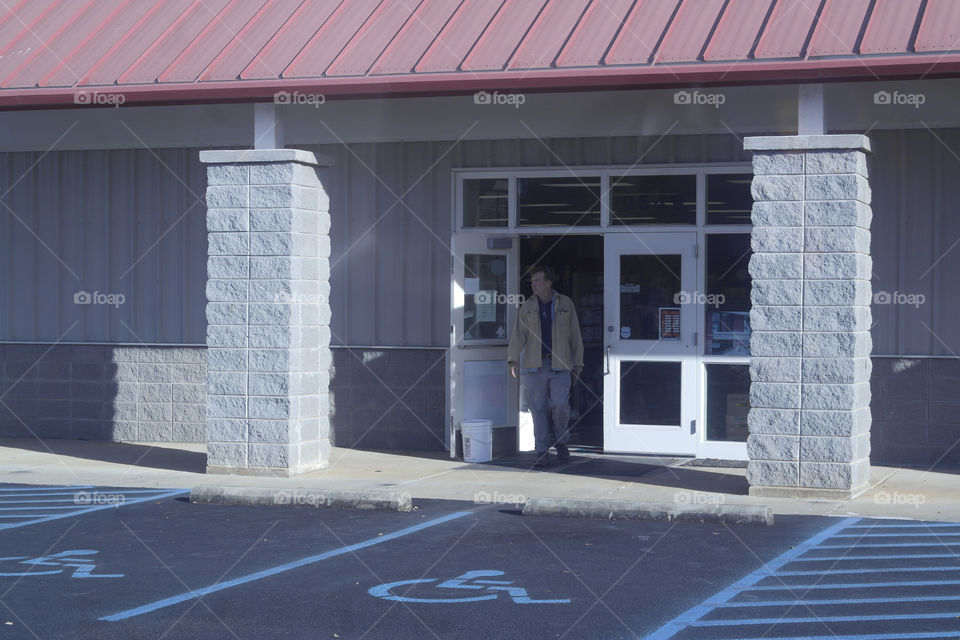 Man walking out of the store
