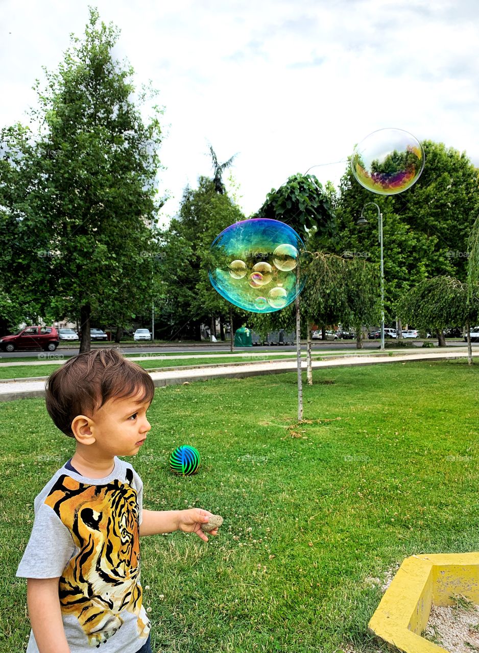 Rainy summer days in the park. Enjoying outdoors activities 