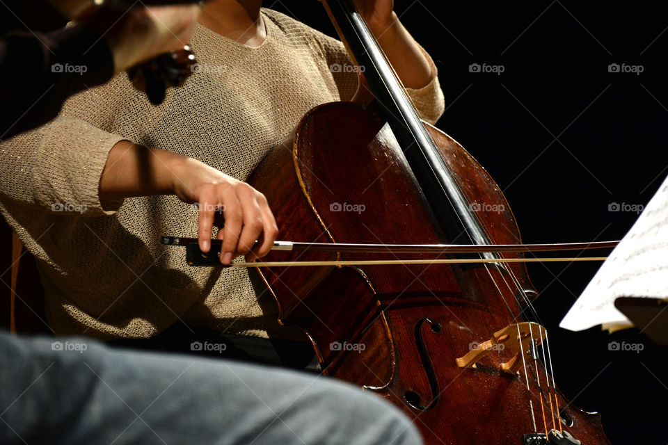 Classical musician playing the Cello during performance