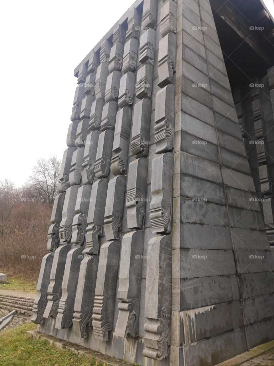 Cacak Serbia stone monument side with carved animal figures