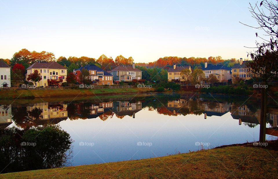 Houses. Reflections in a Lake 
