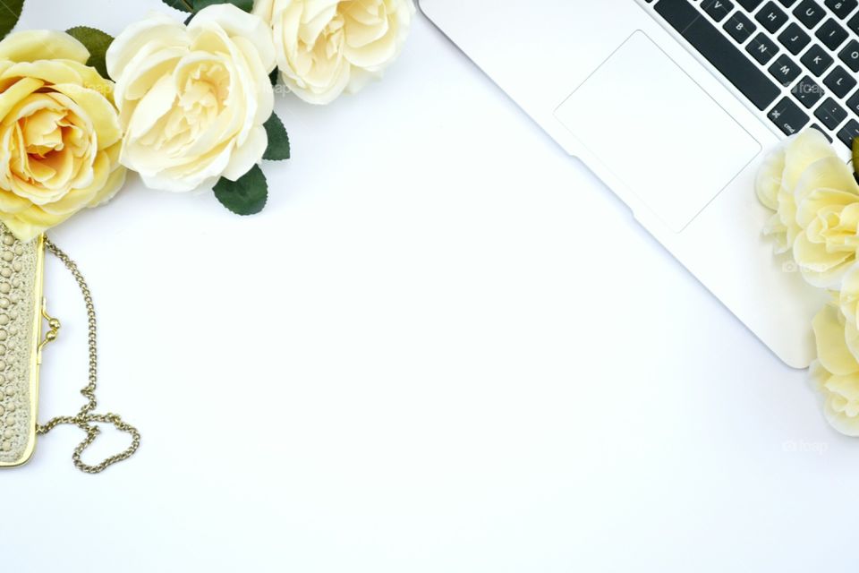 Vintage clutch ,yellow flowers and macbook