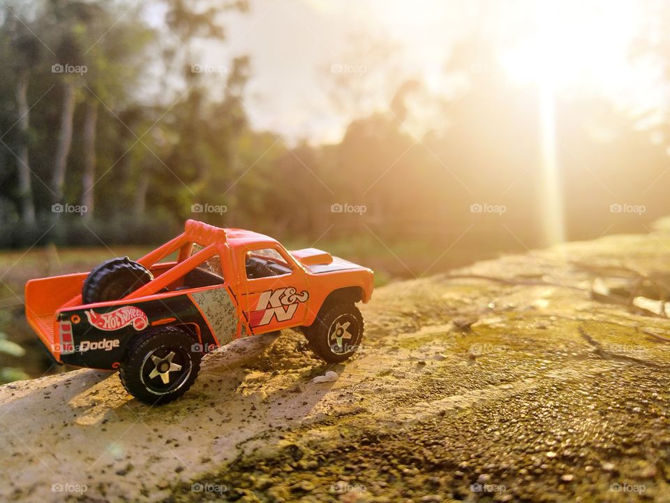 Orange truck against the sun.