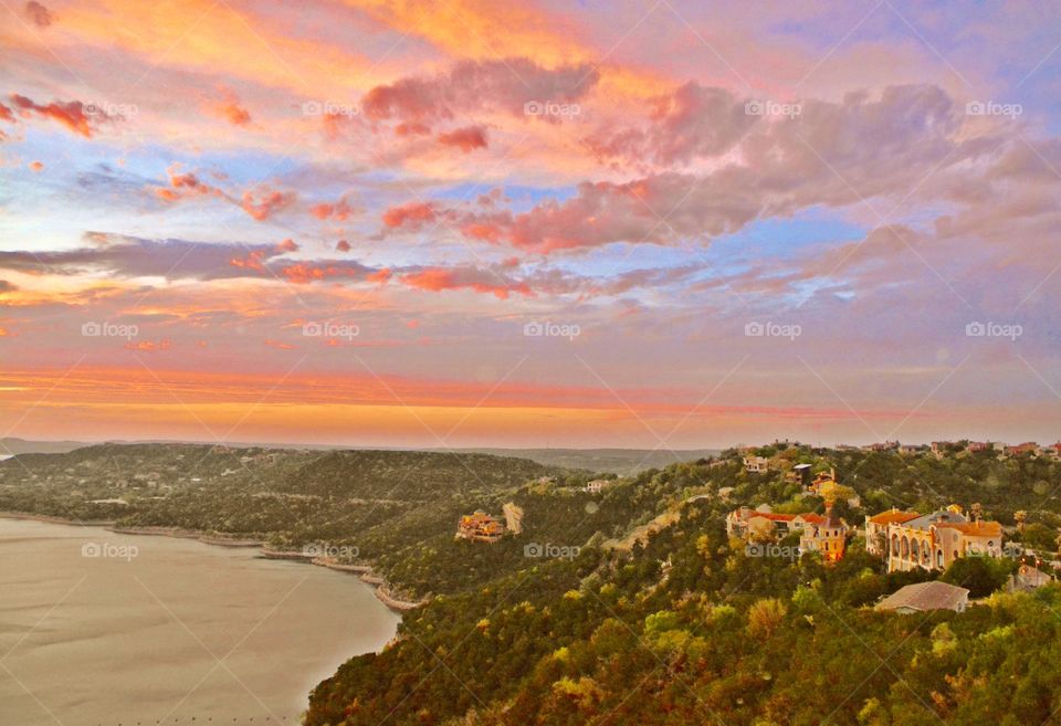 Landscapes of 2019 - Foap Missions - A beautiful view of the colorful sky and Hugh Mansions overlooking Lake Travis in Texas. 