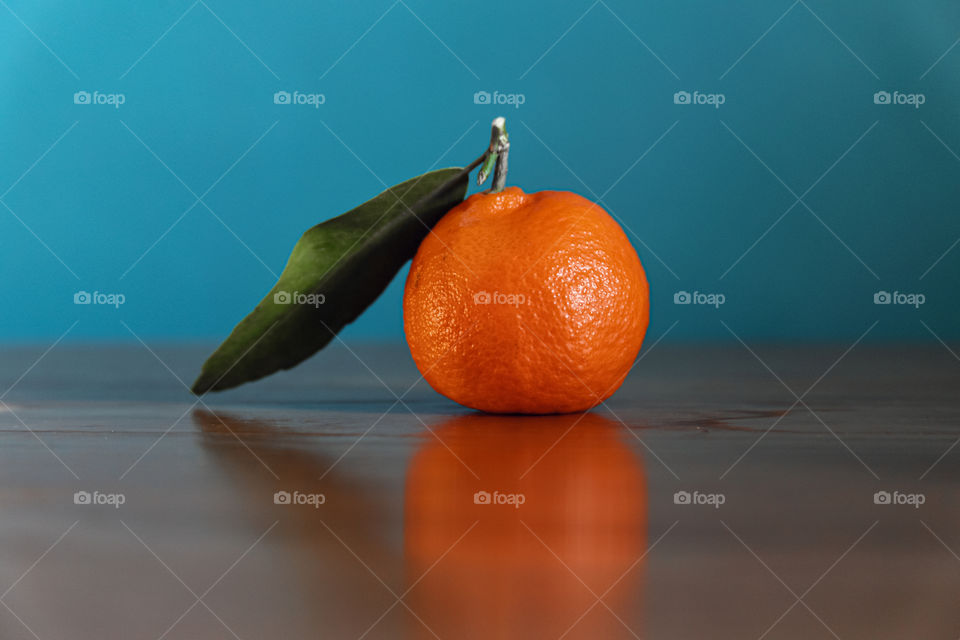 Close-up of tangerine fruit on table 