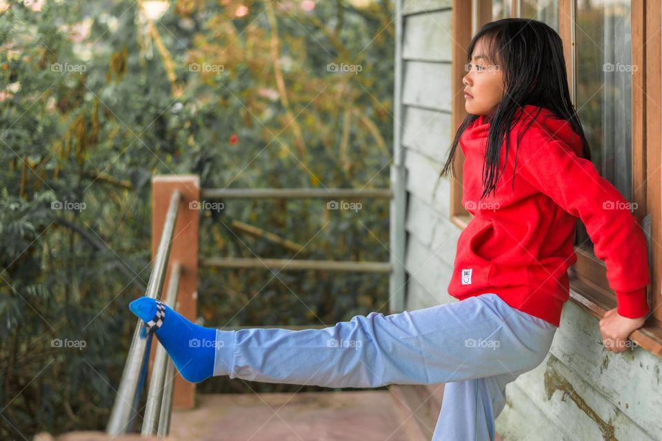 A little kid relaxing in her casual clothing