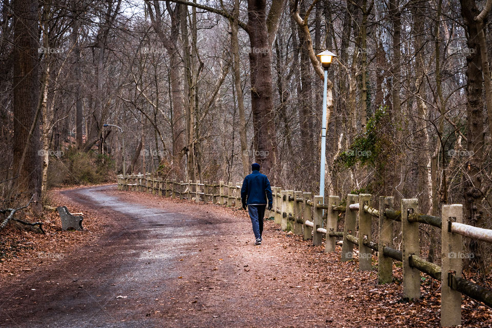 Man Walking Along Trail