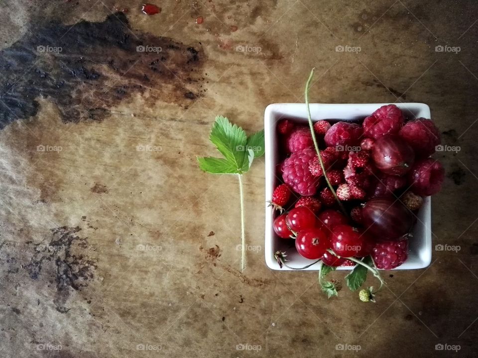 High angle view fresh berries in bowl