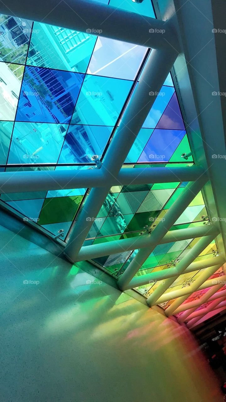 Rainbow glass casting peacefully amid the busy and bustling Miami International Airport. 