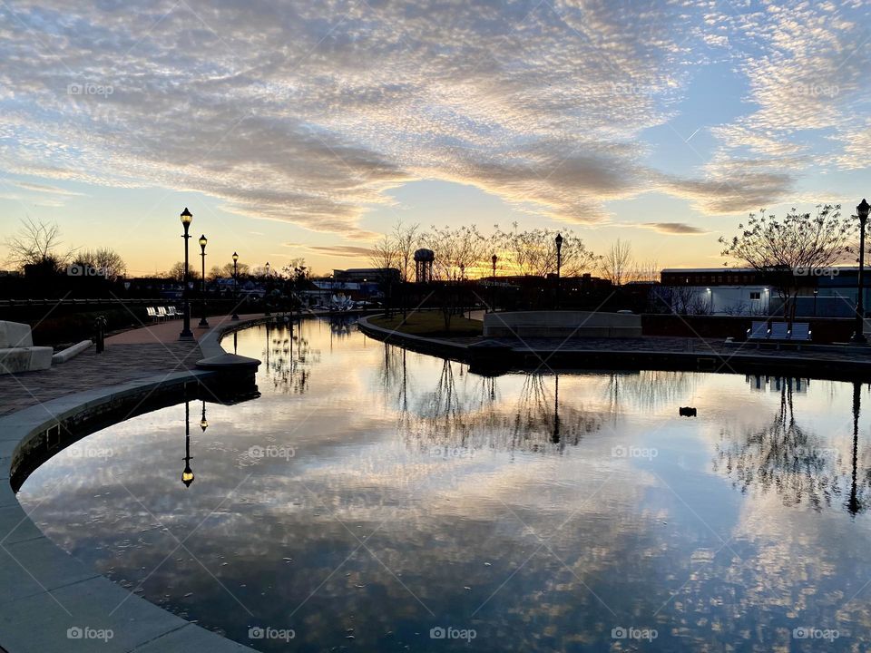 Reflections in the water at sunset on Carroll Creek in Frederick Maryland 