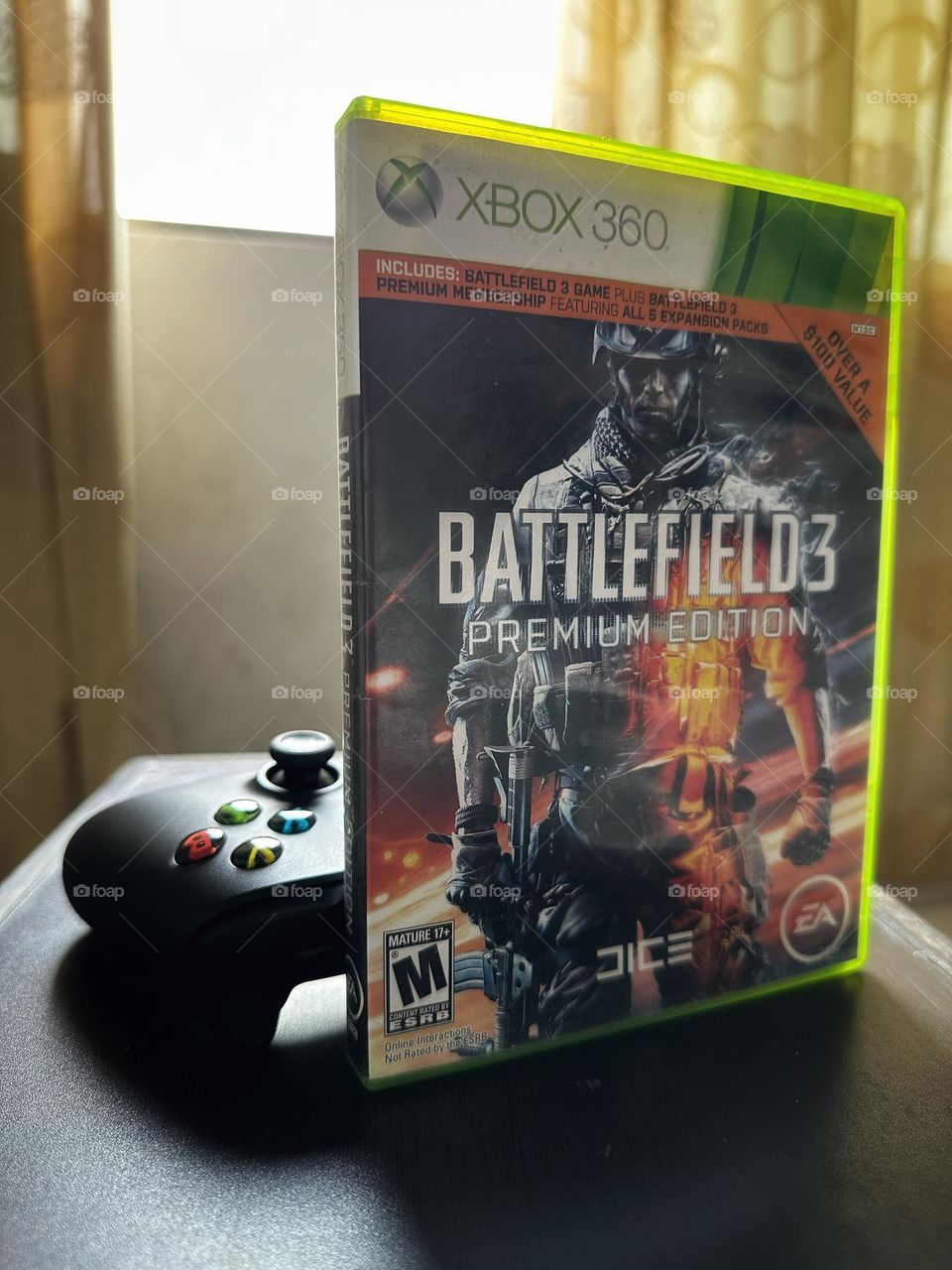 Battlefield video game box in front of a Xbox controller with natural light at the background.