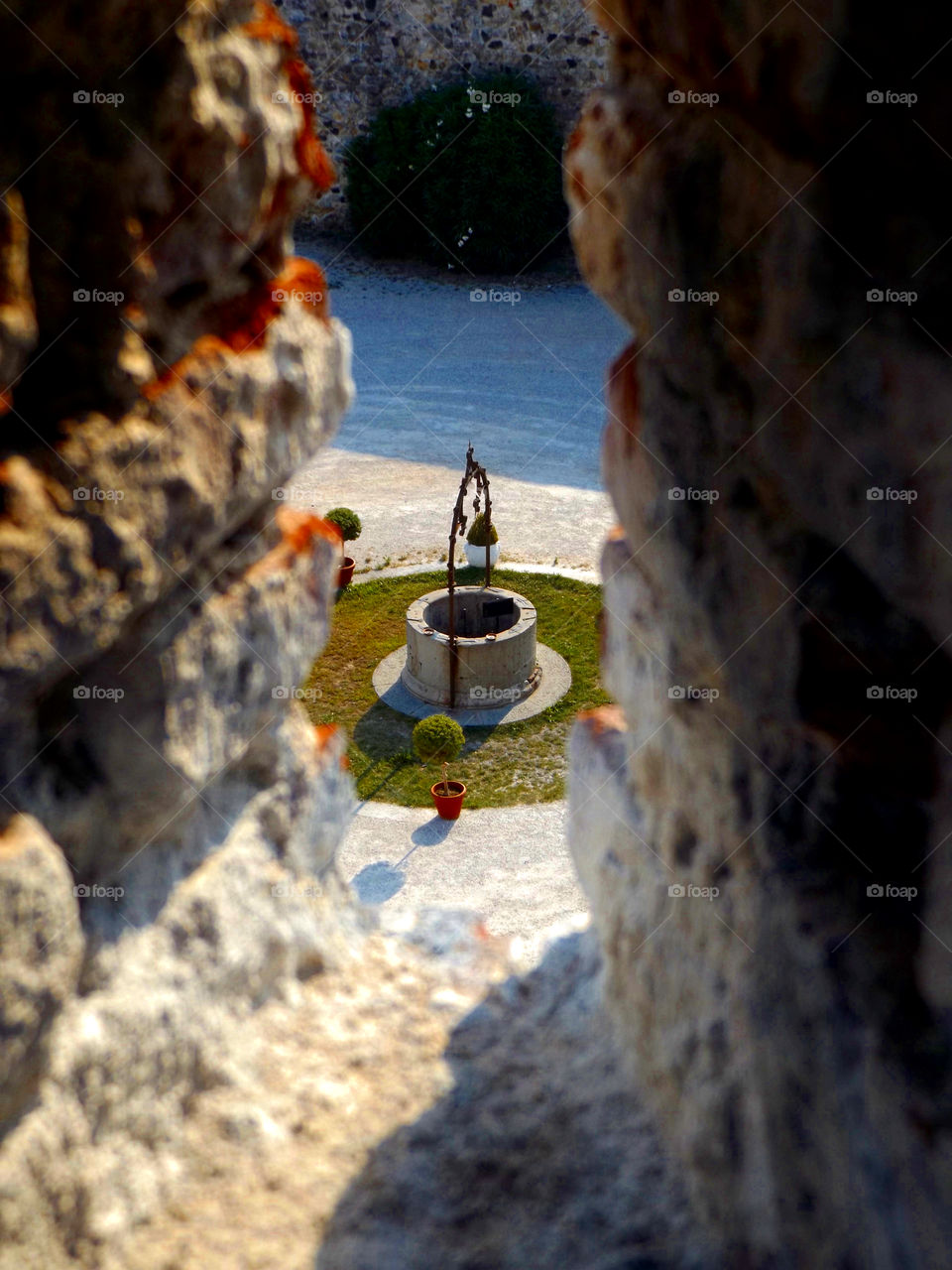 A hole sunk into the ground as a source of water.