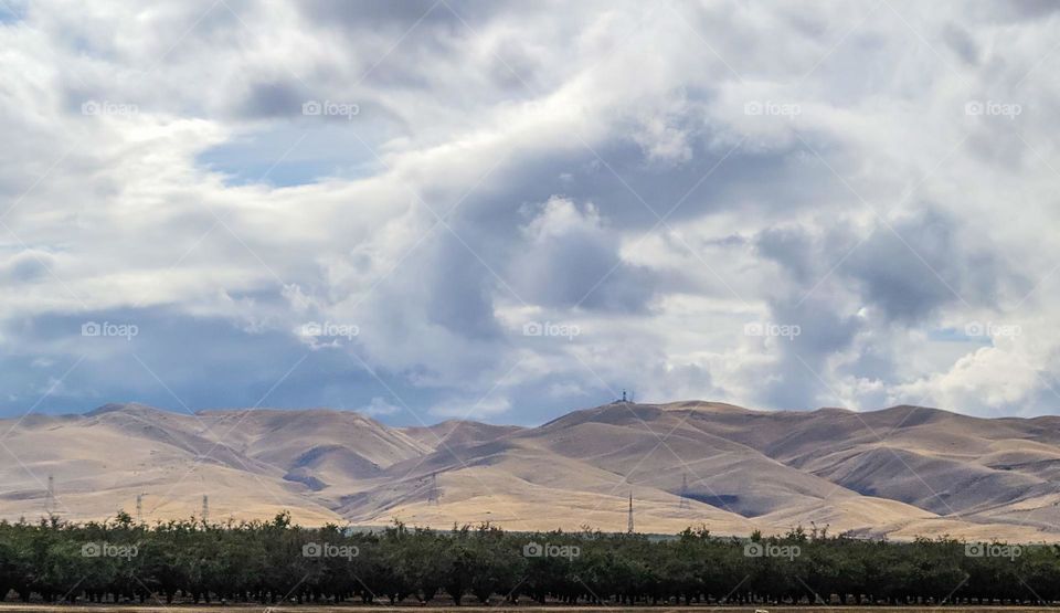 Beautiful landscape off highway 5 south California, beautiful skies with amazing clouds and mountains , giving an almost painterly appearance 