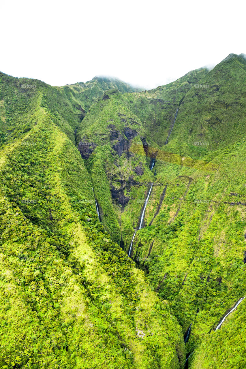 Hidden waterfalls in the Nā Pali coast. 
Kauai, Hawaii 