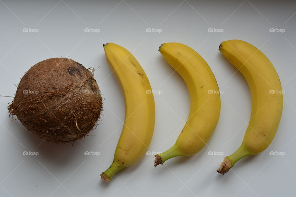 banana and coconut fruits white top view isolated