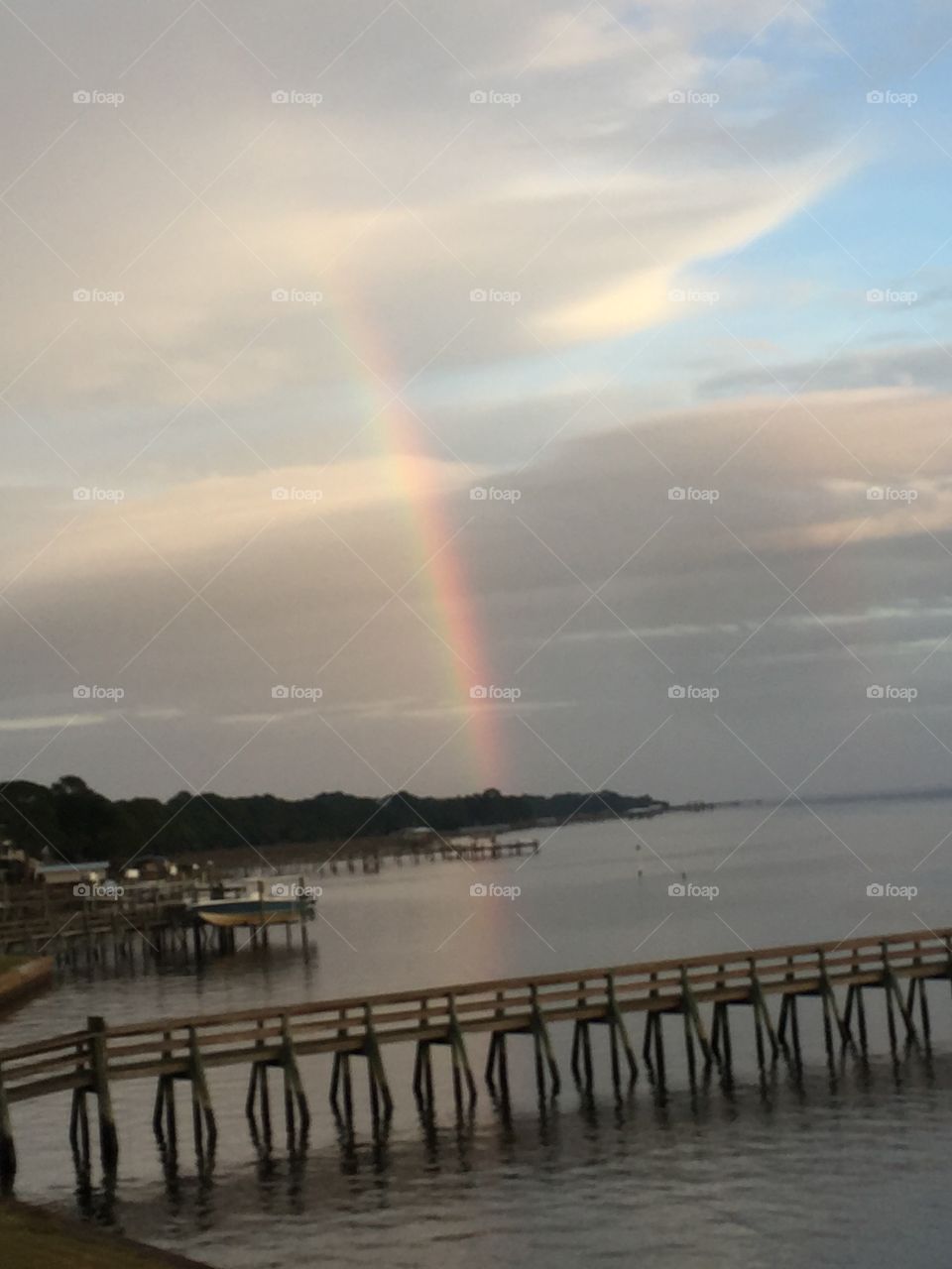 Rainbow reflecting on the bay. 