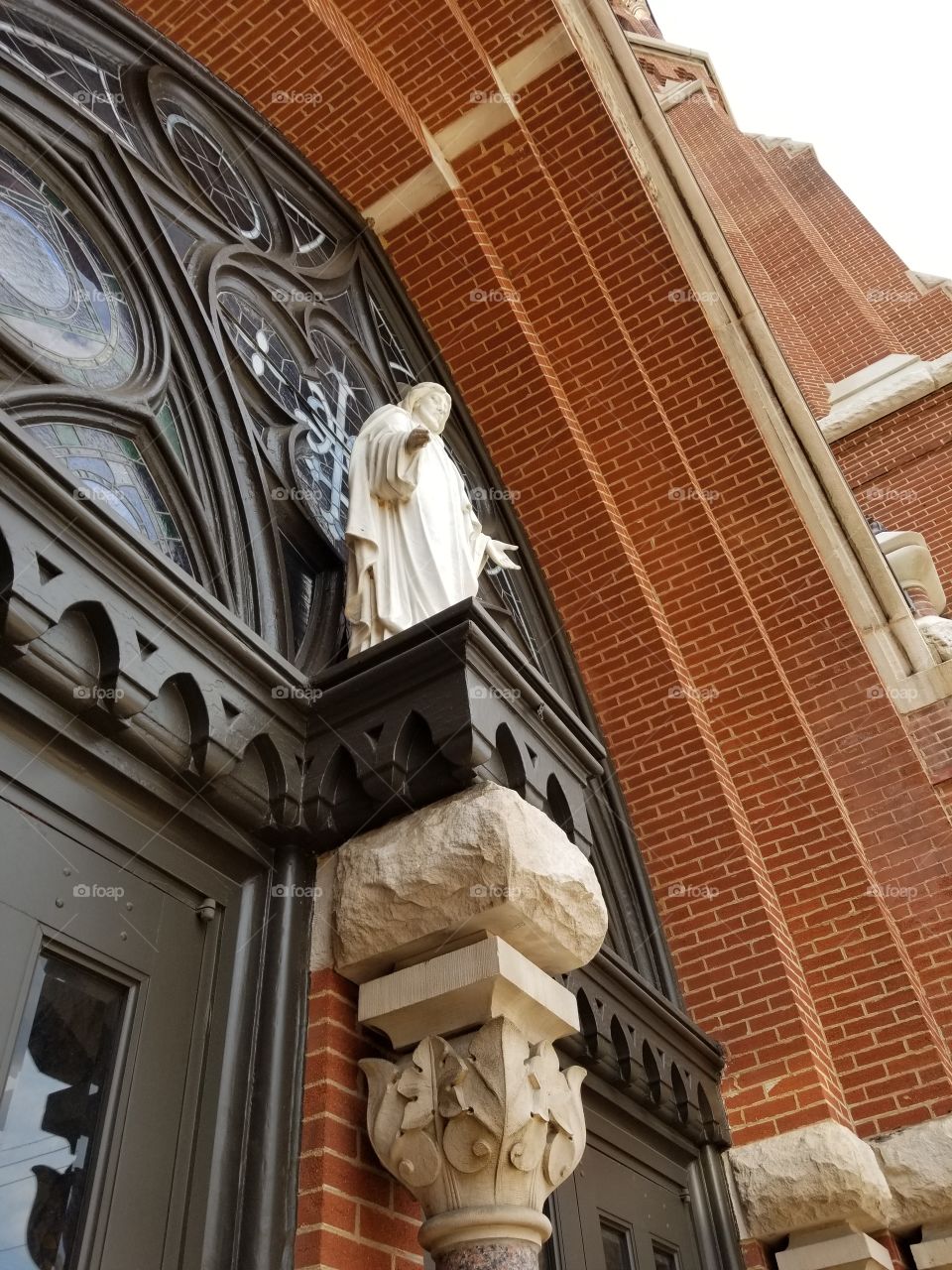 great view of the entrance of an old catholic church