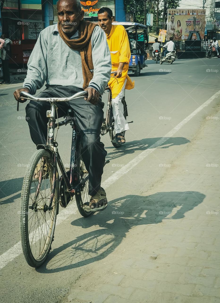 People riding bicycle going on their work